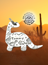 Load image into Gallery viewer, Dino Desert Scene • Personalised Name tag, ID Tag, Dog tag, Cat tag, Custom keyring, Silver Aluminium, Brass or Copper • Dinosaur, Mountain, Desert, Sun, Cactus, birds