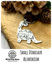 Load image into Gallery viewer, Dino Scene • Personalised Name tag, ID Tag, Dog tag, Cat tag, Custom keyring, Silver Aluminium, Brass or Copper • Dinosaur, Mountain, tree, birds