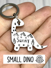 Load image into Gallery viewer, Dino Forest Scene • Personalised Name tag, ID Tag, Dog tag, Cat tag, Custom keyring, Silver Aluminium, Brass or Copper • Dinosaur, Mountain, Trees, birds